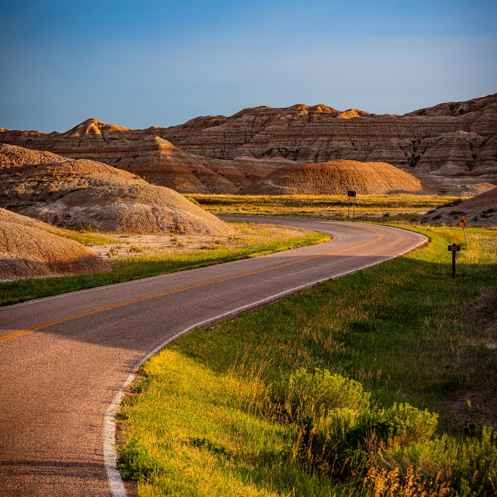 Badlands road at golden hour